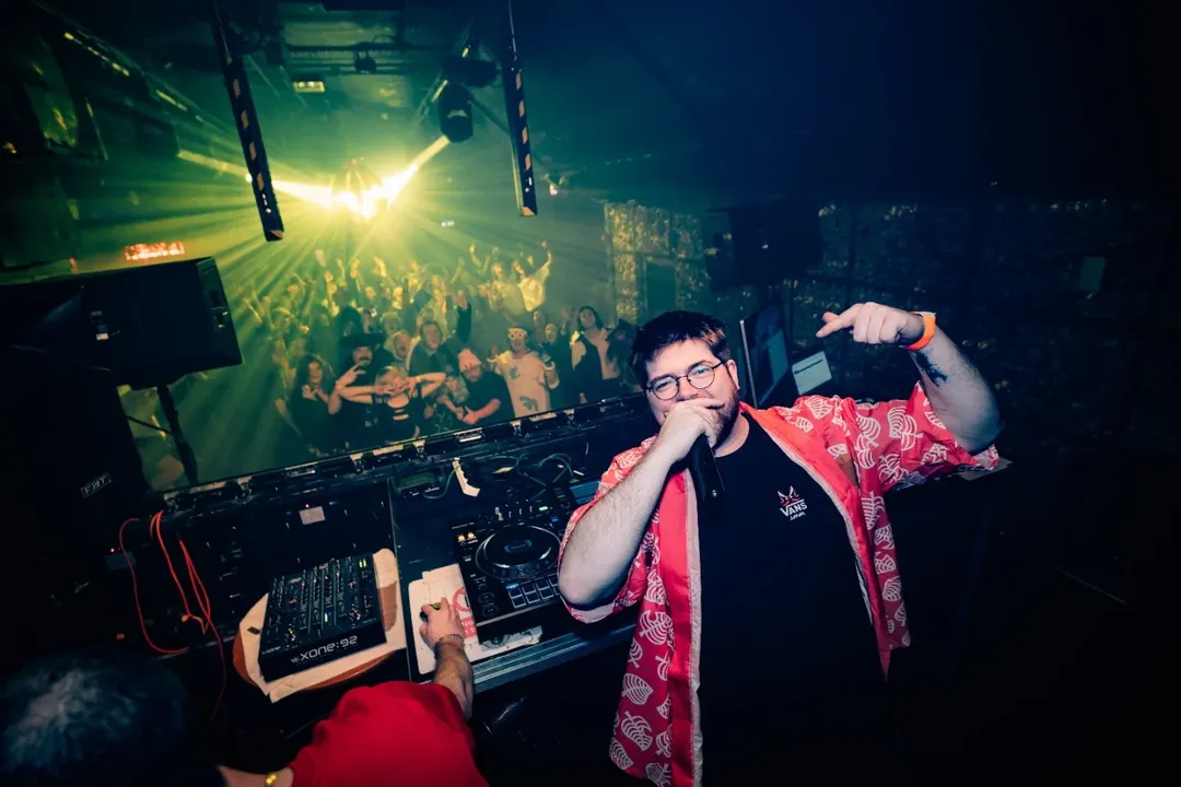 Callum on stage at Anime Disco with crowd