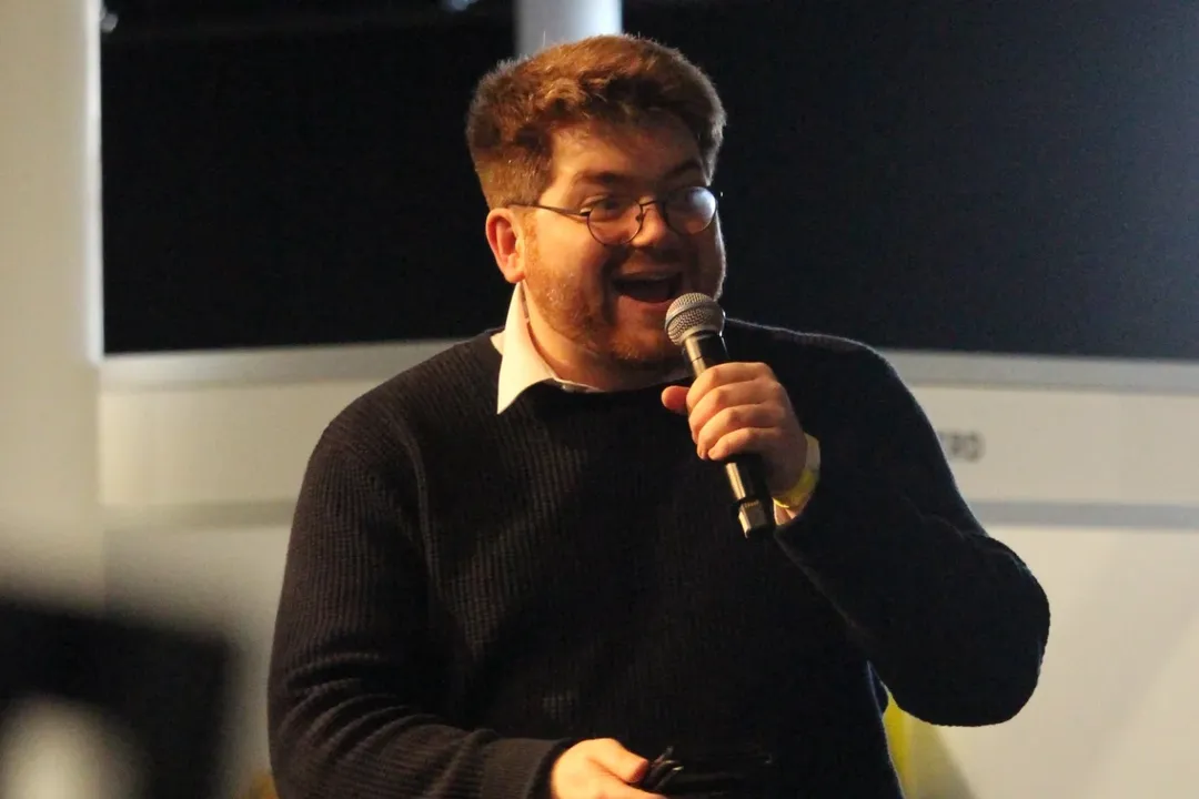 Callum Janes speaking on stage